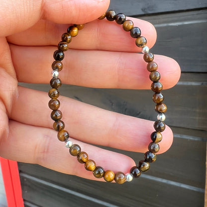 PULSERA ELASTICADA "FUERZA INTERIOR Y SEGURIDAD" | Ojo de tigre | Plata 925