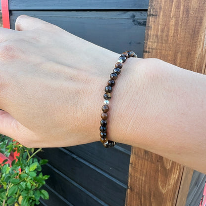 PULSERA ELASTICADA "FUERZA INTERIOR Y SEGURIDAD" | Ojo de tigre | Plata 925