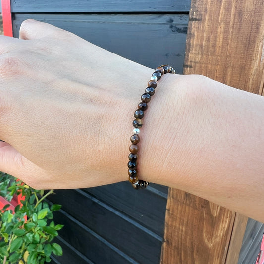 PULSERA ELASTICADA "FUERZA INTERIOR Y SEGURIDAD" | Ojo de tigre | Plata 925
